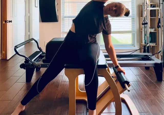Mary-Ann Zykin practicing pilates on a Balanced Body EXO chair.